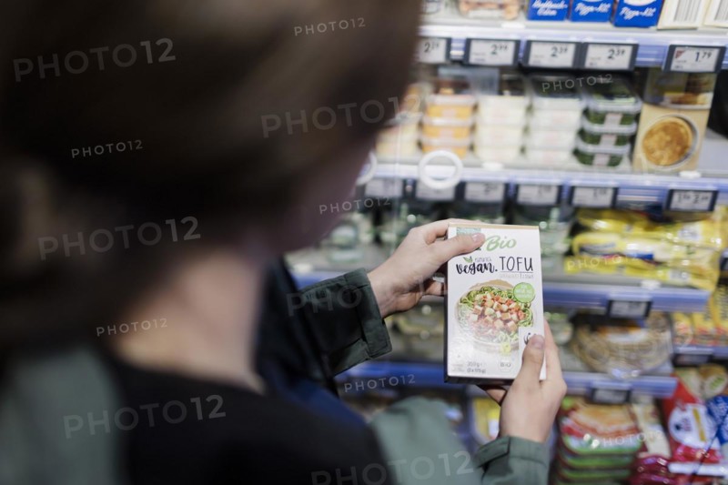 Elderly woman shopping in supermarket, Radevormwald, Germany, Europe