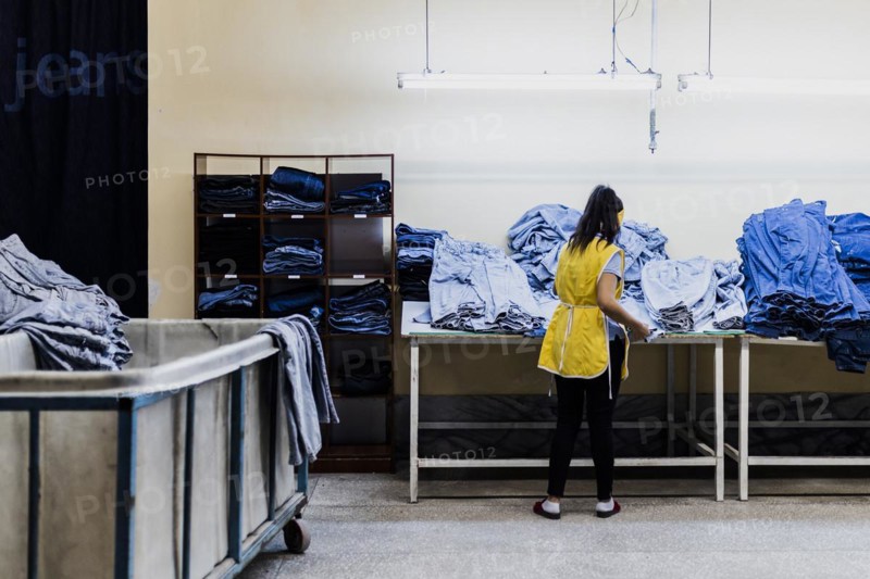A worker sorts jeans at the Afrasyab jeans factory in Samarkand, 02.11.2022., Samarkand, Uzbekistan, Asia
