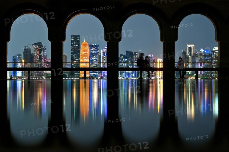 View of the illuminated skyline of Doha, Qatar, from the terrace of the Museum of Islamic Art by the archtics Ieoh Ming Pei and Jean-Michel Wilmotte, Asia