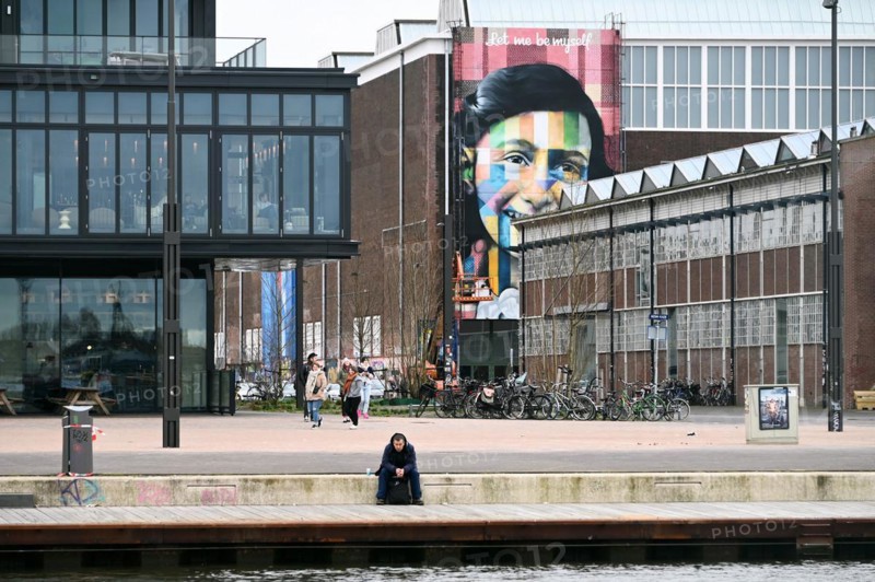 Anne Frank portrait on the facade of the Straat Museum, NDSM Plein, Amsterdam, Netherlands