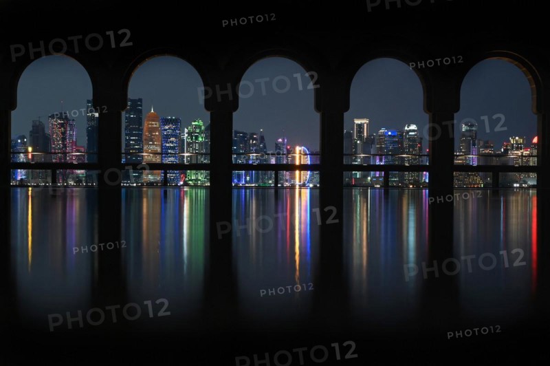 View of the illuminated skyline of Doha, Qatar, from the terrace of the Museum of Islamic Art by the archtics Ieoh Ming Pei and Jean-Michel Wilmotte, Asia