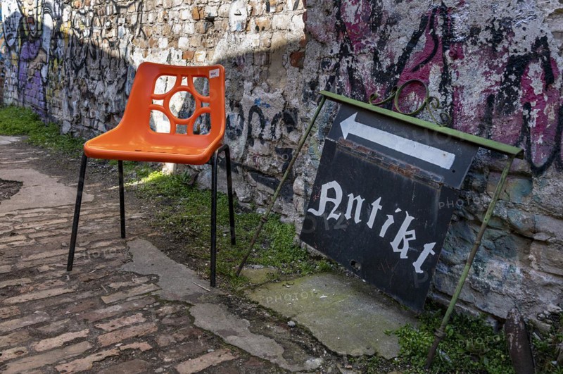 Plastic chair in orange, RAW site, former Reichsbahn repair works, Friedrichshain, Berlin, Germany, Europe
