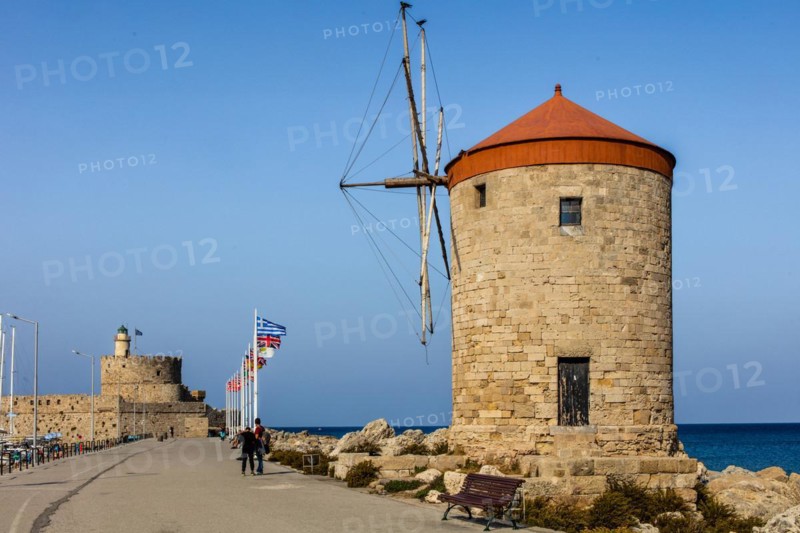 Three windmills on the pier with Agios Nikolaos fortress, Mandraki harbour, Rhodes Town, Greece, Europe