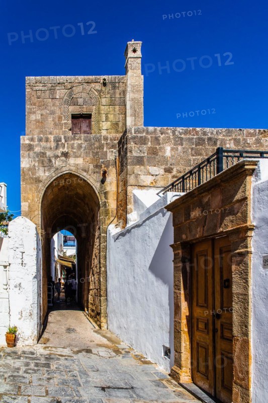 Captains house in the winding streets with white houses, Lindos, Rhodes, Greece, Europe