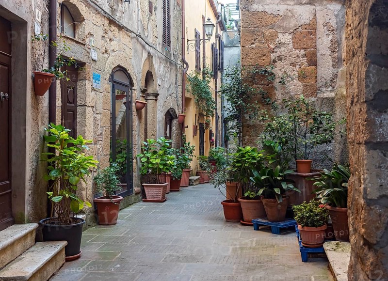 Courtyard with flowerpots, Pitigliano, Tuscany, Italy, Europe
