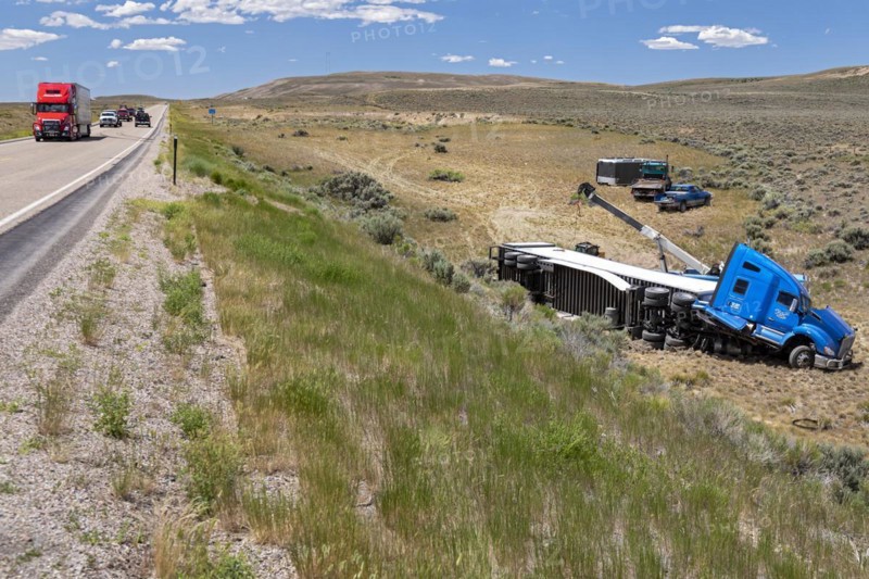 Diamondville, Wyoming, A semi-trailer truck that drove off U.S. Highway 30 and overturned in southwestern Wyoming