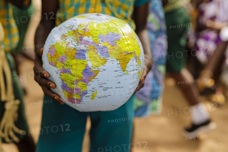 Theme: School children in Africa with an inflatable globe, Krokrobite, Ghana, Africa