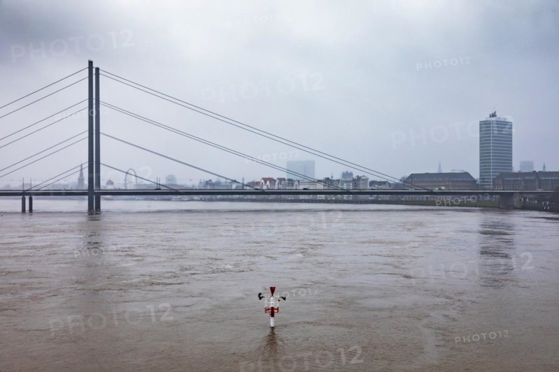 High water on the Rhine in Duesseldorf - Navigation sign at the harbour entrance with view of the Rheinkniebruecke and the old town, Duesseldorf, North Rhine-Westphalia, Germany, Europe