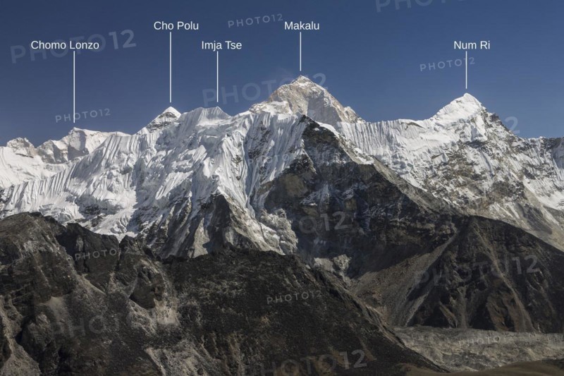 View from Chukhung Ri, a trekking peak located in the upper part of the Imja Khola valley. Imja Tse, known as Island Peak, the popular 6000-metres-plus peak, is just ahead. Makalu, the worlds sixth-highest mountain, is the highest mountain in this view and indeed looks the highest in this picture. Autumn trekking season. Khumbu, the Everest Region, Himalayas. Photo with peak labels. Sagarmatha National Park, a UNESCO World Heritage Site. Solukhumbu, Nepal, Asia
