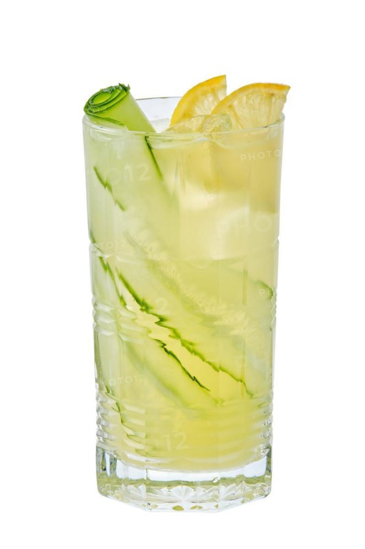 Tall glass of cold lemon and cucumber lemonade isolated on white background