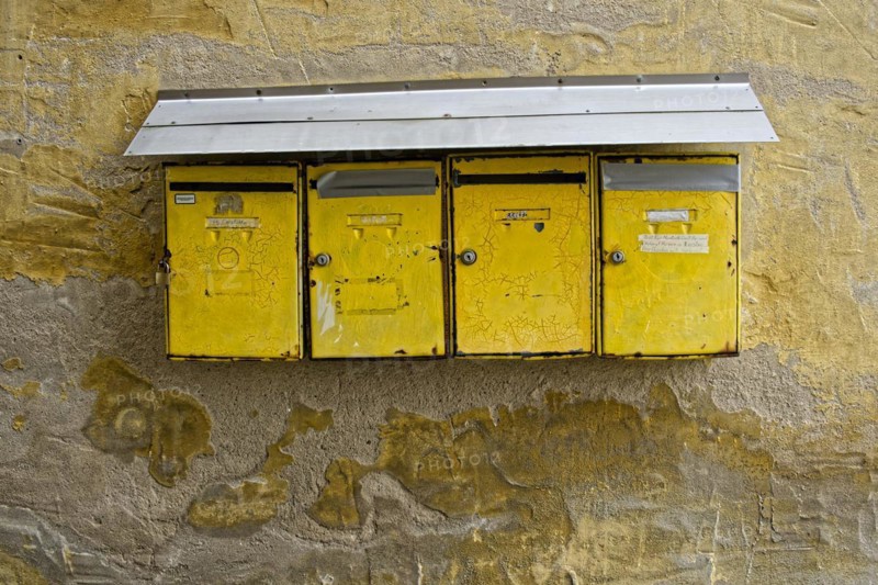 Old battered house letter boxes