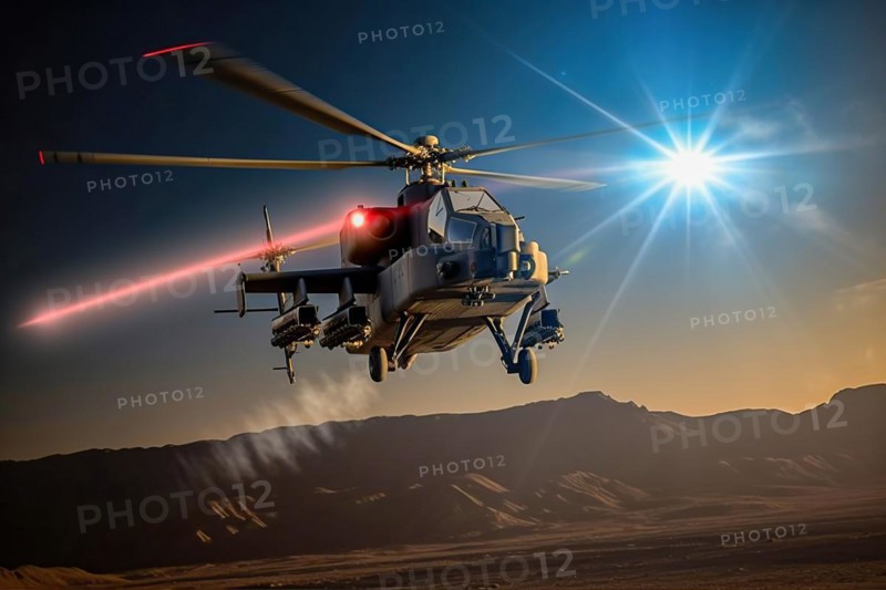 Combat helicopter fires laser cannon at a target