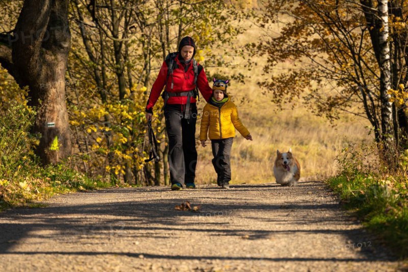 Mum and child are walking along the mountain hiking trail. Family spending time. Polish mountains