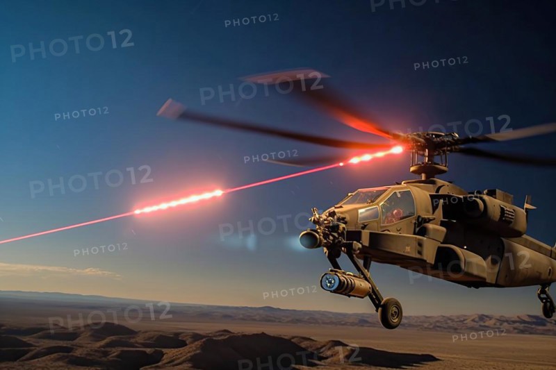 Combat helicopter fires laser cannon at a target