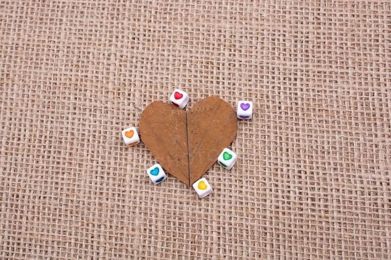 Colorful cubes with a heart on leaf on canvas