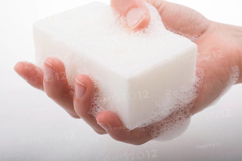 Hand washing and soap foam on a foamy background