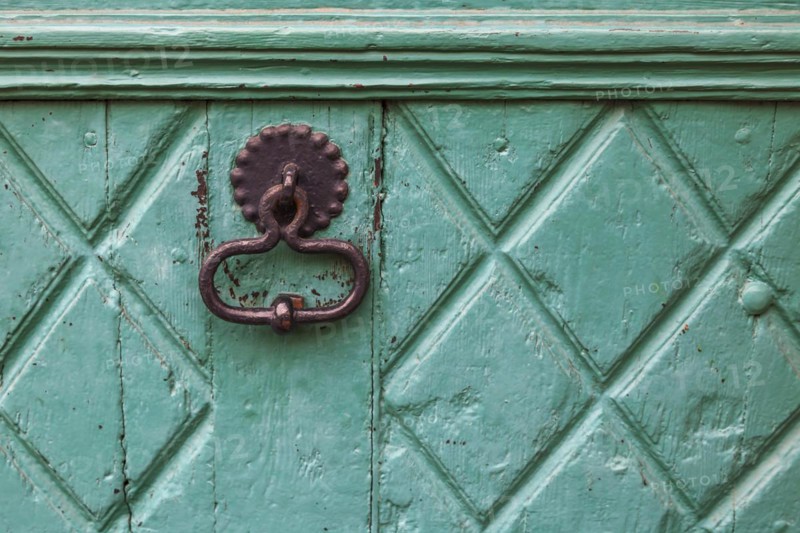 Door knocker on an old wooden door
