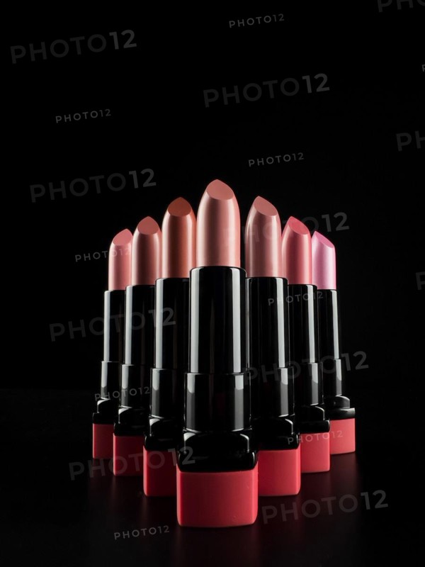 A set of lipsticks on a black background. makeup artist content