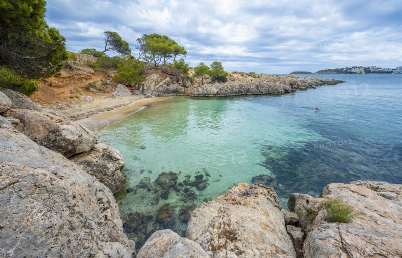 Small bay with sandy beach and blue sea