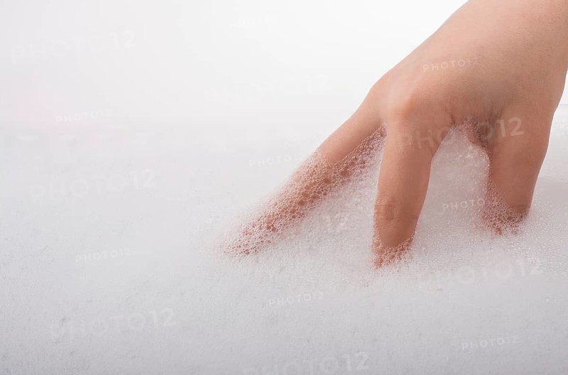 Hand washing and soap foam on a foamy background
