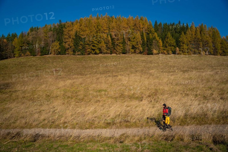 Mum and child are walking along the mountain hiking trail. Family spending time. Polish mountains