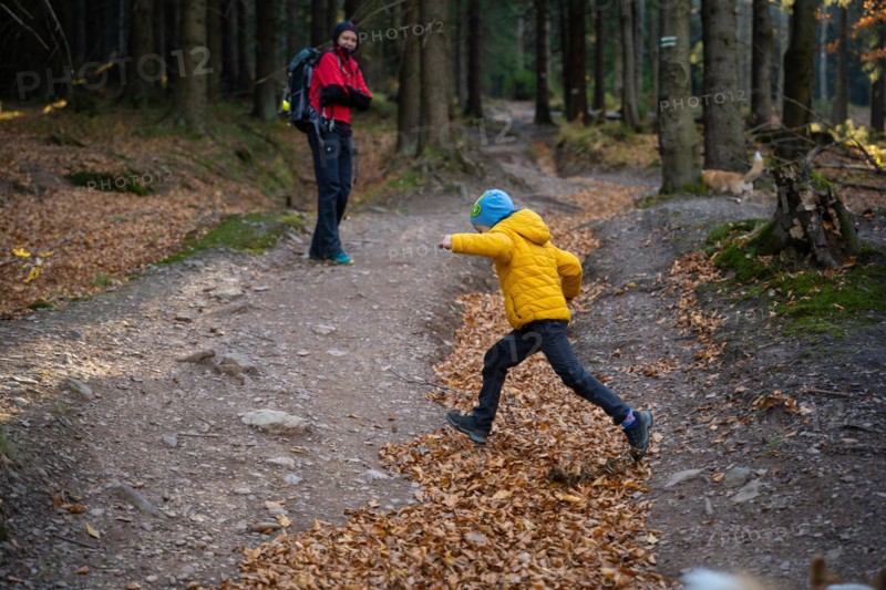 Mum and child are walking along the mountain hiking trail. Family spending time. Polish mountains