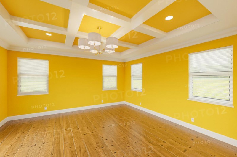 Beautiful bold yellow custom master bedroom complete with fresh paint