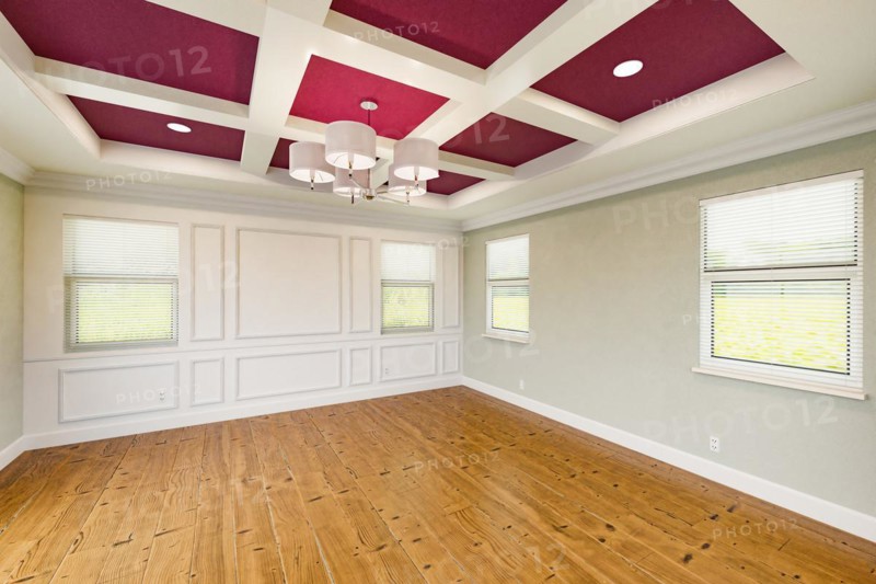 Beautiful purple and tan custom master bedroom complete with entire wainscoting wall