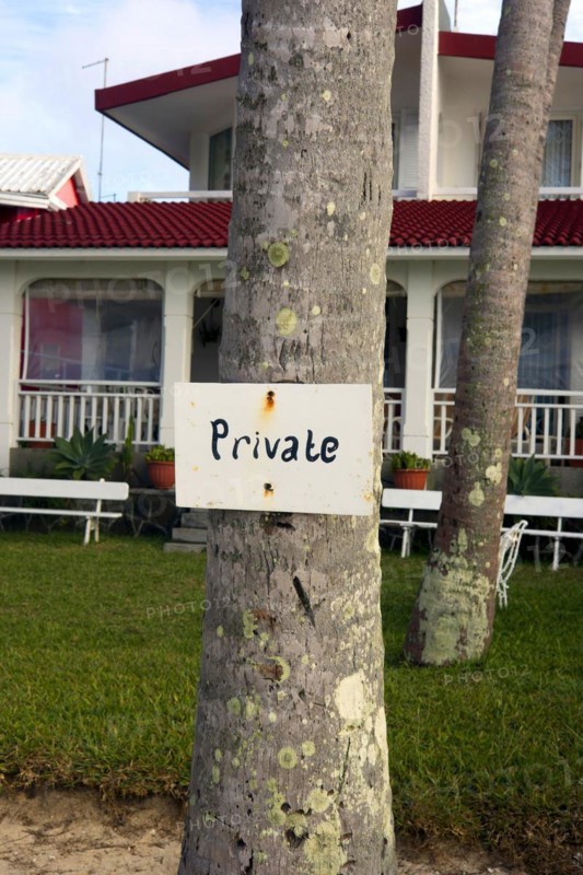 A sign saying Private was nailed to a tree trunk as a hint