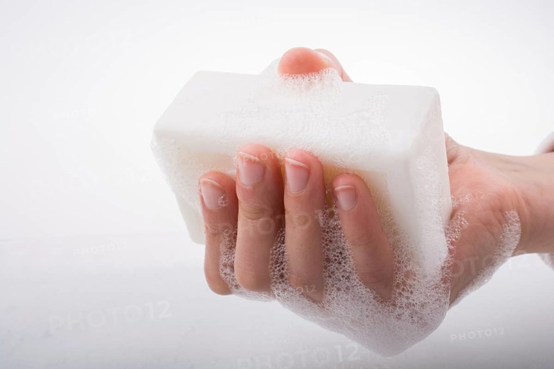 Hand washing and soap foam on a foamy background