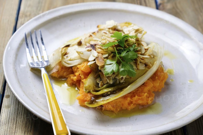 Sweet potato puree with chicory served on a plate
