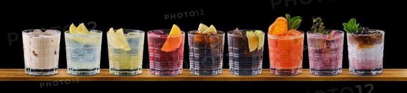 Set of multicolored summer refreshing soft drinks on black background