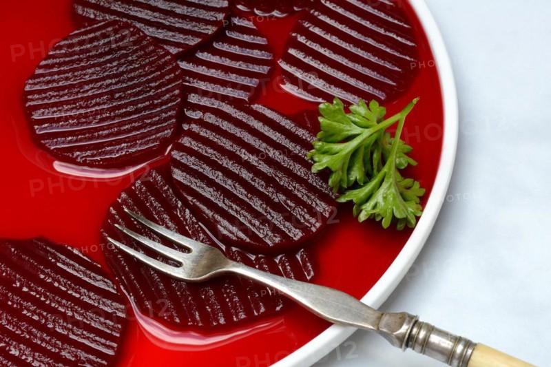 Sliced pickled beetroot on plate