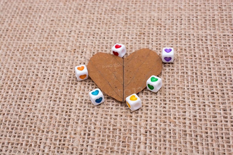 Colorful cubes with a heart on leaf on canvas