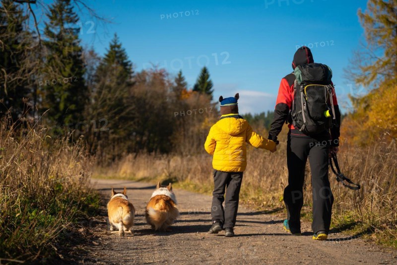 Mum and child are walking along the mountain hiking trail. Family spending time. Polish mountains