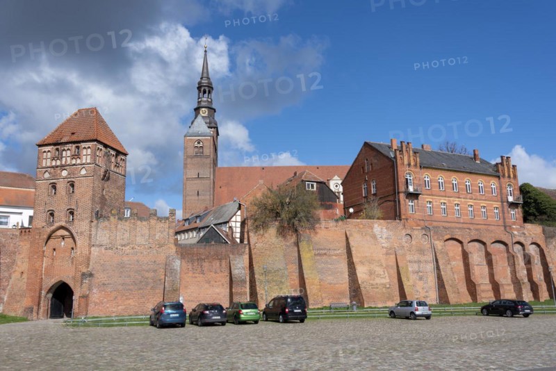 Historic town wall with defence defence tower and St. Stephens Church