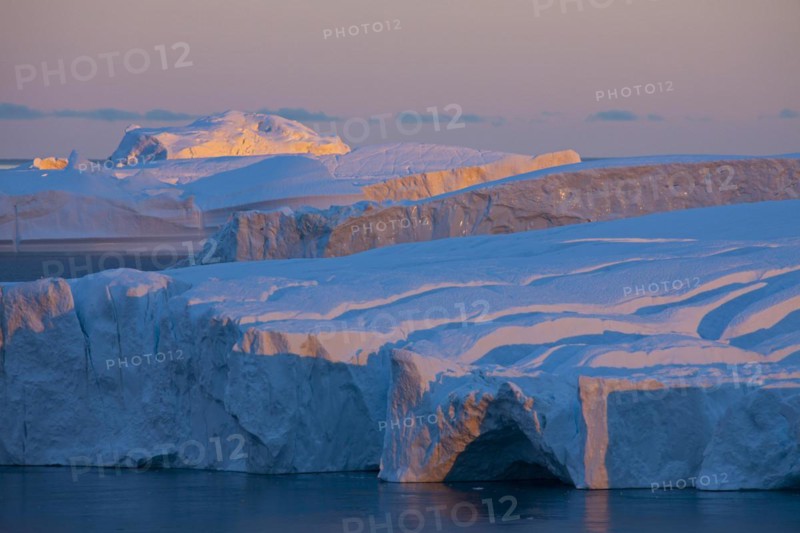 Icebergs at sunset in the Kangia icefjord