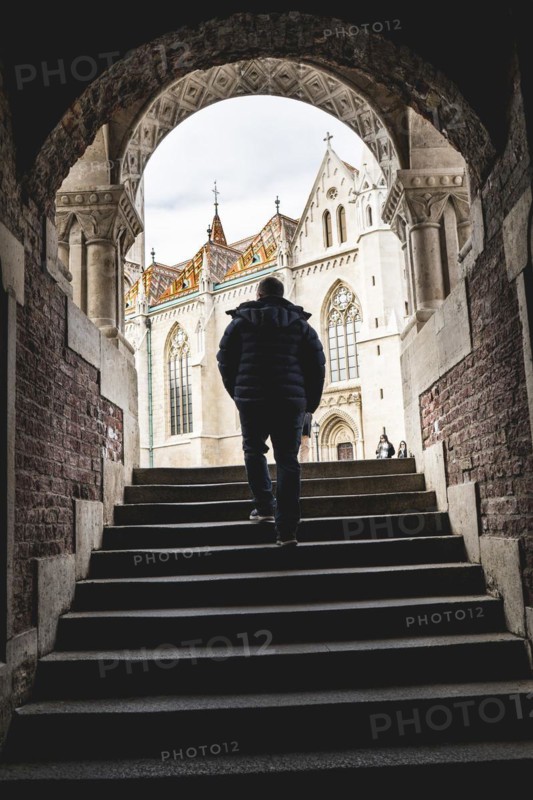 A man arriving at the Fishermans Bastion at the heart of Budas Castle District in Budapest