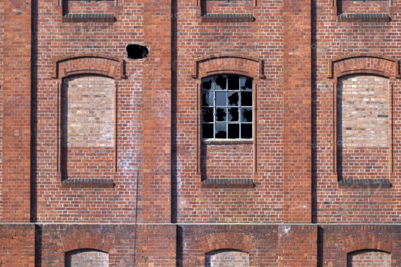 Destroyed window on an old factory building