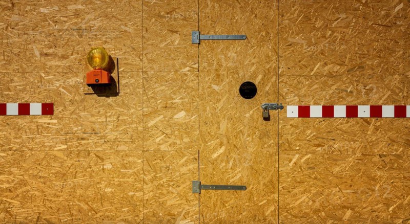 Building fence made of chipboard