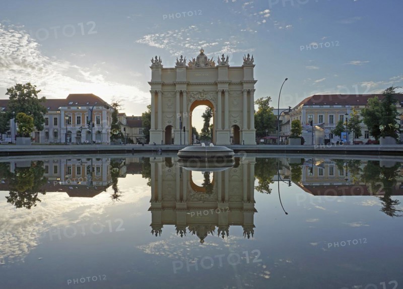 Reflection Brandenburg Gate in water basin