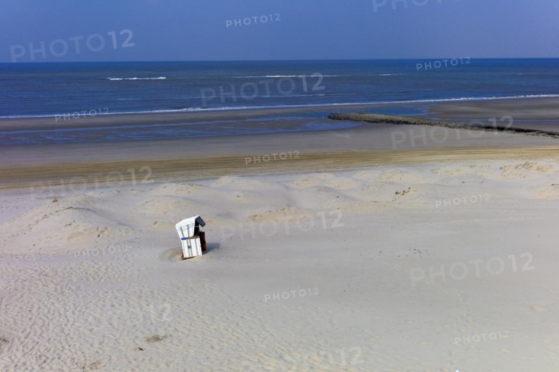 Lonely beach chair on the beach of the island of Wangerooge