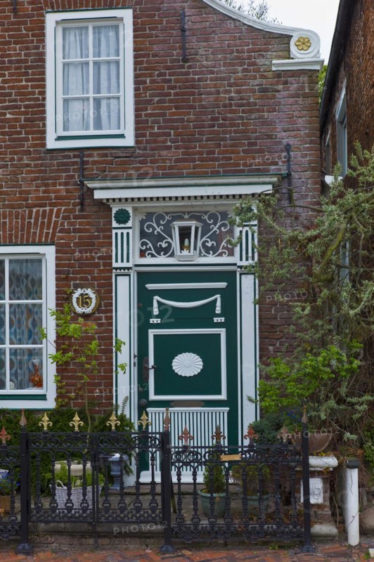 Front door on an old house on the edge of the harbour in Greetsiel