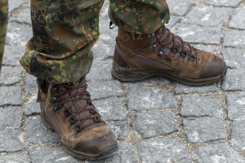 Soldier with camouflage suit and combat boots on the sidelines of the handover roll call of the German Field Army in Nymphenburg Palace