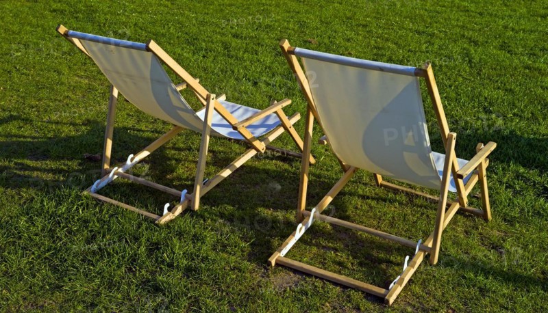 Two deckchairs on a lawn