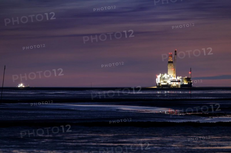 Germanys only oil rig Mittelplate at night and low tide