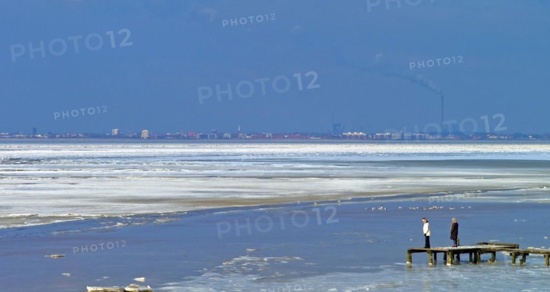 View over the frozen Jade Bay towards Wilhelmshaven