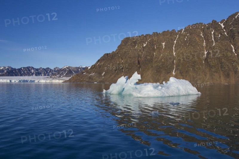 Calved iceberg from the Lilliehoeoekbreen glacier melting in the Lilliehoeoekfjorden