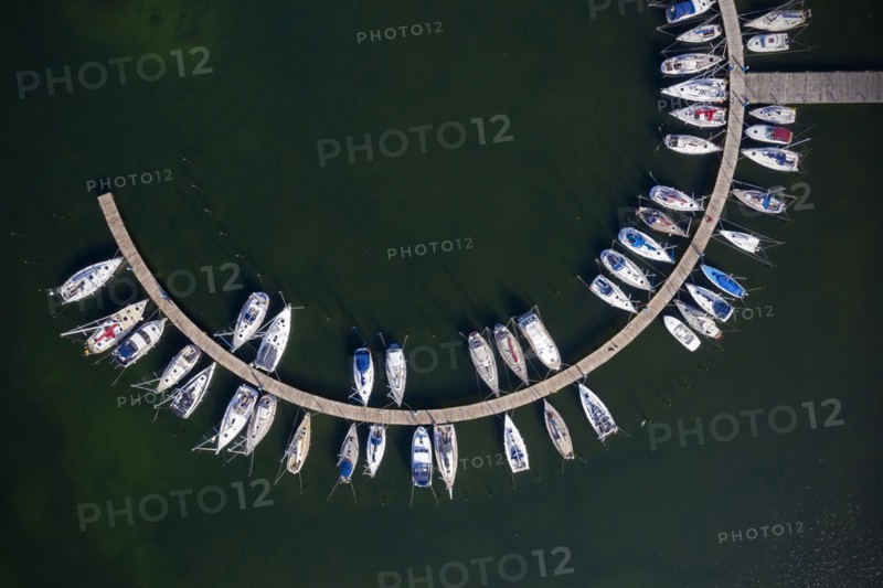 Aerial view over sailing boats docked in the Burgtiefe marina at on Fehmarn