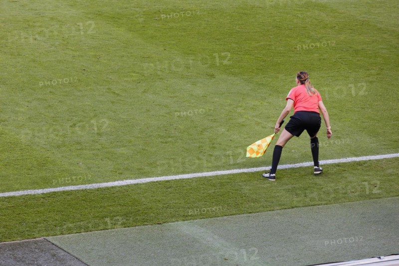 Lineswoman on the sidelines of a football match